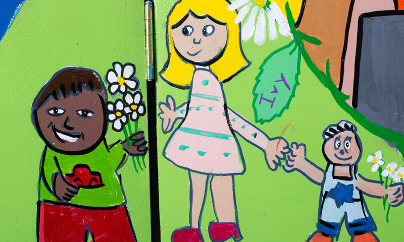 Three children holding hands