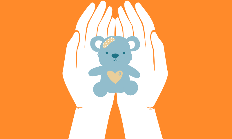 hands with teddy bear in it